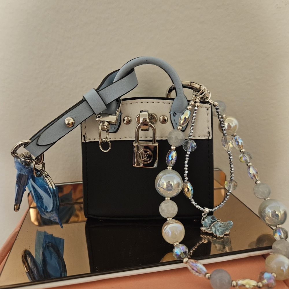 Elegant Blue and White Handbag with Beaded Strap